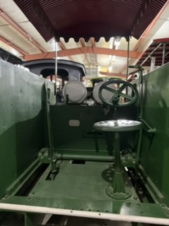 Sun-shaded tractor seat with spring suspension