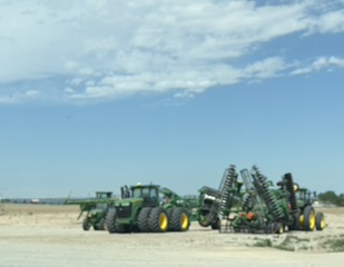 Modern farm tiller on the highway