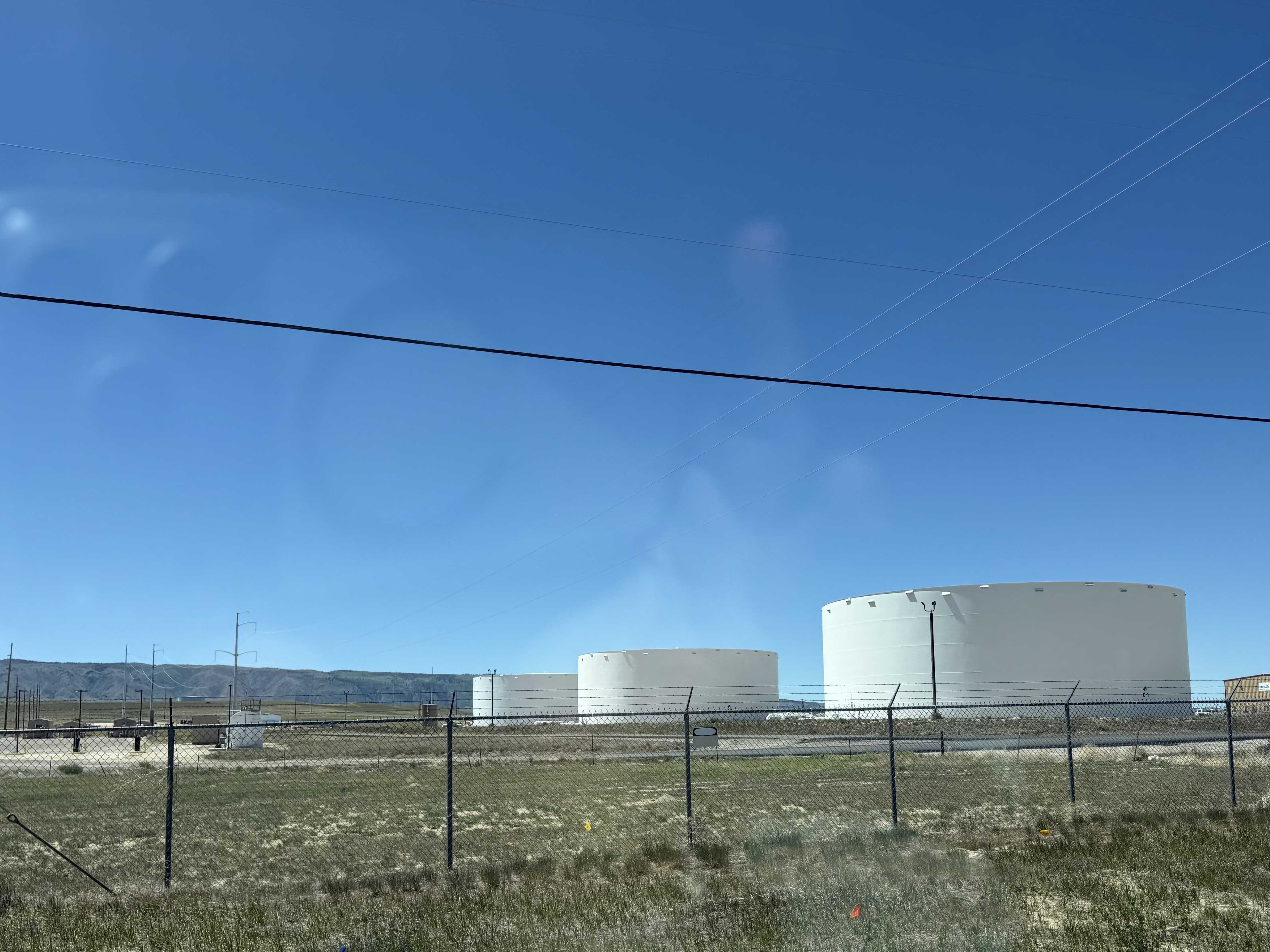 Crude oil holding tanks on the Wyoming plain