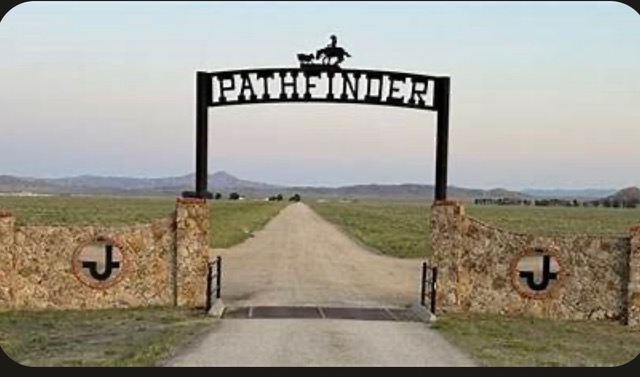 Pathfinder Ranch entrance gate with brand