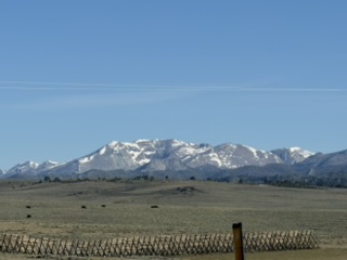 Snow on the Rockies to the west