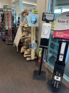 Hats for sale with a hand mirror