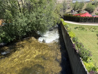Inflatable tubes floating under the bridge near the hot springs