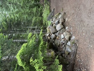 Rock cairn at the unknown pioneer woman grave on Barlow Road