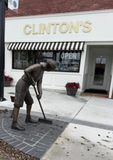 Statue of young Harry Truman at his first job at Clinton's